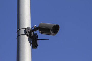 Security camera, city safe, blue sky