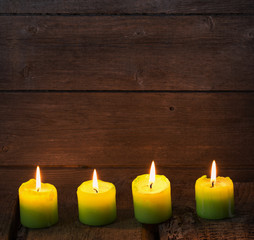 Fototapeta na wymiar candles on old wooden background