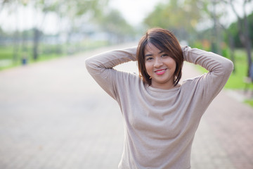 Portrait Asian woman in a park.