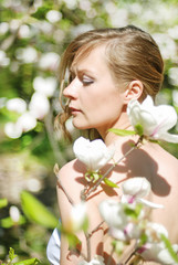 Fototapeta premium beautiful blonde girl in spring garden