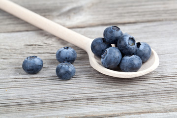 Blueberries on a wooden spoon