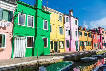 Fototapeta na wymiar Green Yellow and Pink Burano Homes