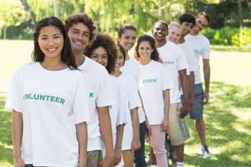 Confident volunteers standing in a line