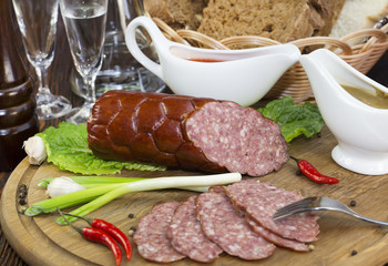 sausage on a wooden plate in a restaurant