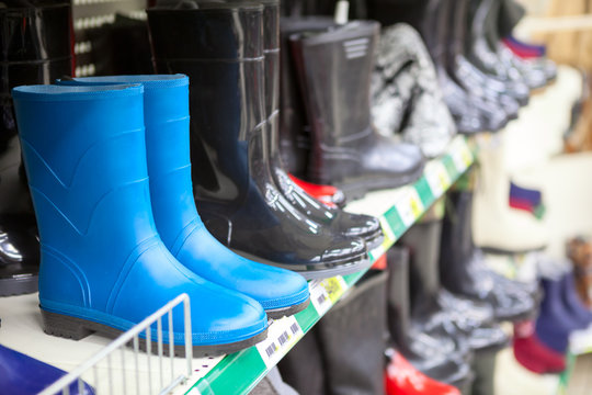 Blue and black waterboots are on the shop shelves