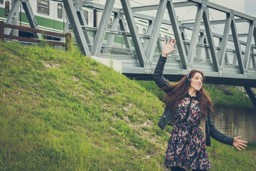 Pretty girl with long hair listening to music