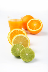 Fototapeta na wymiar Orange juice and slices of orange and lemonade isolated on white
