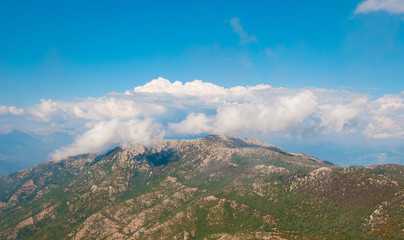 Obraz premium Turkey Babadag mountain on the background of clouds and sky.