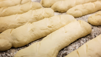Raw dough ready for baking homemade baguettes
