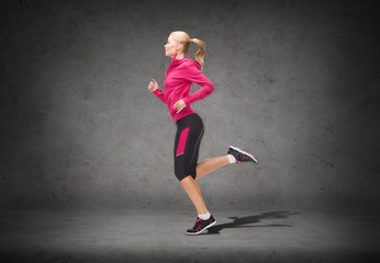 sporty woman running or jumping