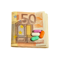Pills and Euro notes isolated on white