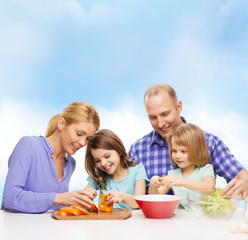 happy family with two kids making dinner at home