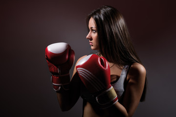 Beautiful woman with the boxing gloves