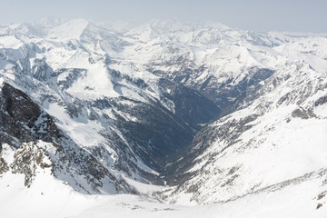 Alpine valley surrounded with mountains