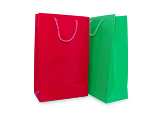 Red and green paper shopping bags isolated