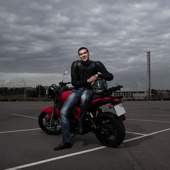 Obraz na płótnie Canvas biker and his motorbike