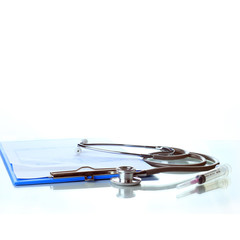 Clipboard, pen and medical stethoscope.