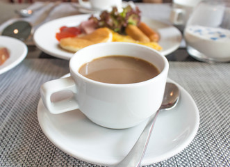 Coffee cup and saucer on table