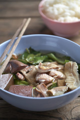 pork soup in thai food on wooden table