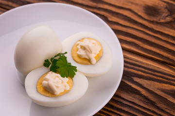 Deviled eggs with parsley in a plate
