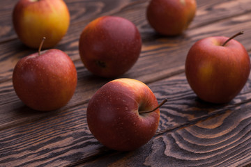 red apples on wooden table, selective focus