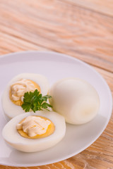 Deviled eggs with parsley in a plate