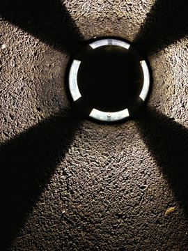 propeler shadow made by the lamp on the ground