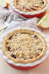 Fresh delicious apple-raisins tart with oatmeal crumble.