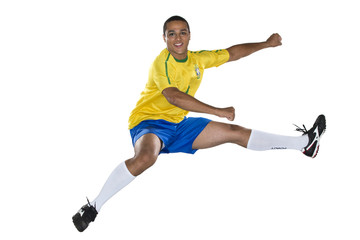 Fototapeta na wymiar Brazilian Soccer player, jumping, yellow and blue