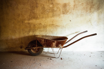 old rusty metal wheelbarrow
