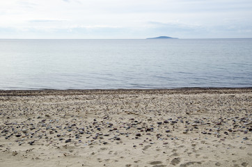 View at an island from a sandy beach