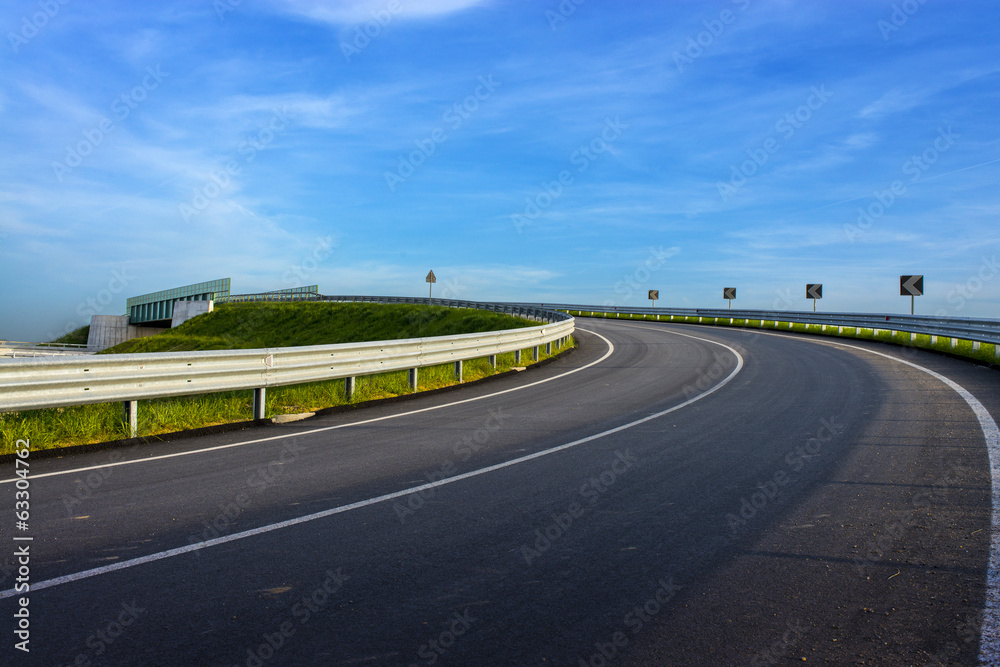 Wall mural turn in the road with guard rail