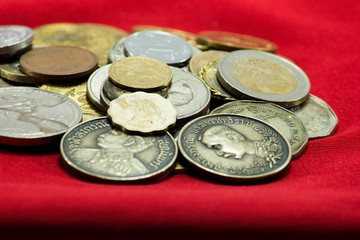 a collection of various currencies coin from countries the globe