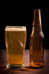 fresh beer near bottle empty