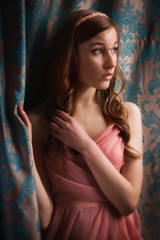 Obraz premium Beautiful young girl in the vintage interior