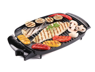 Grilled seabass on grill with vegetables