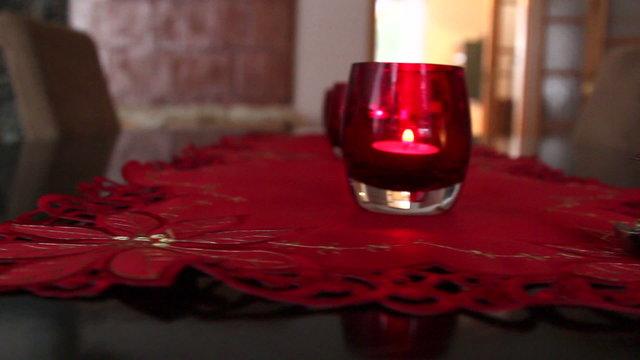 Three candles in red glass