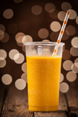 Glass of healthy orange mango smoothie