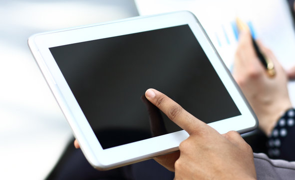 woman hand touching screen on modern digital tablet pc