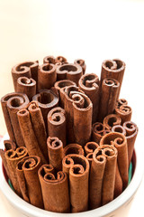 Obraz na płótnie Canvas Heap of aromatic cinnamon sticks. Closeup.