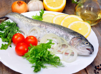 trout on a plate with vegetables
