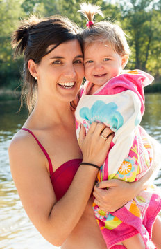 Beautiful Mommy And Baby After Bathing In The River