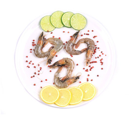 Raw shrimps on plate. Close up.