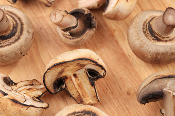 Mushrooms on wooden platter.