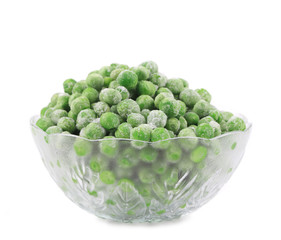 Glass dish with green frozen peas.