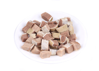 Raw chopped cow tongueon plate.