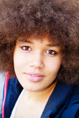 Portrait of a beautiful young woman with afro hair cut