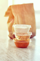 Takeaway plastic bowls with sauces