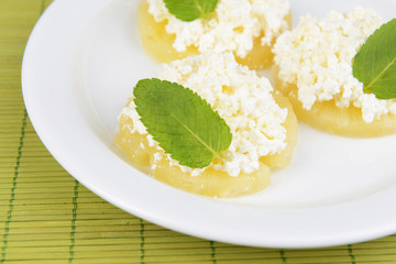 Tasty pineapple with cottage cheese, close up