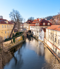 Fototapeta na wymiar Old watermill on Chertovka river in Prague.